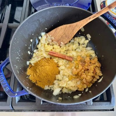 red-lentil-curry-step4 saute spices and aromatics in a blue pot